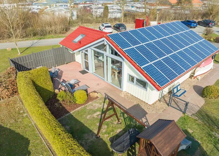 Σπίτι διακοπών Kinderfreundliches 5 Personen Wellnessferienhaus Treibholz Mit Zwei Duschen Und Toiletten, Sauna, Whirlpool, Kaminofen, Wintergarten Und Kanu In Otterndorf